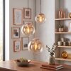 Cluster-hanglamp Gastor met 3 glazen bollen in amber en helder, voor de eettafel