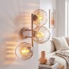 Moderne wandlamp Koyoto met drie geribbelde glazen bollen in amber en helder