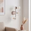 Moderne wandlamp Koyoto met drie heldere geribbelde glazen bollen, zandkleurig armatuur
