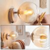Moderne wandlamp Gastor met ronde amberkleurige glazen bol en E14-fitting