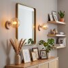 Moderne bolvormige wandlamp Gastor naast de spiegel met amberkleurige glazen kap, set van 2