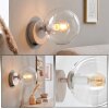 Ronde wandlamp Gastor met heldere bol en zichtbare E14-fitting voor bij de bank