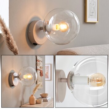 Ronde wandlamp Gastor met heldere bol en zichtbare E14-fitting voor bij de bank