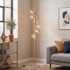 Retro vloerlamp Koyoto met zes glazen bollen in helder en amber, met voetschakelaar